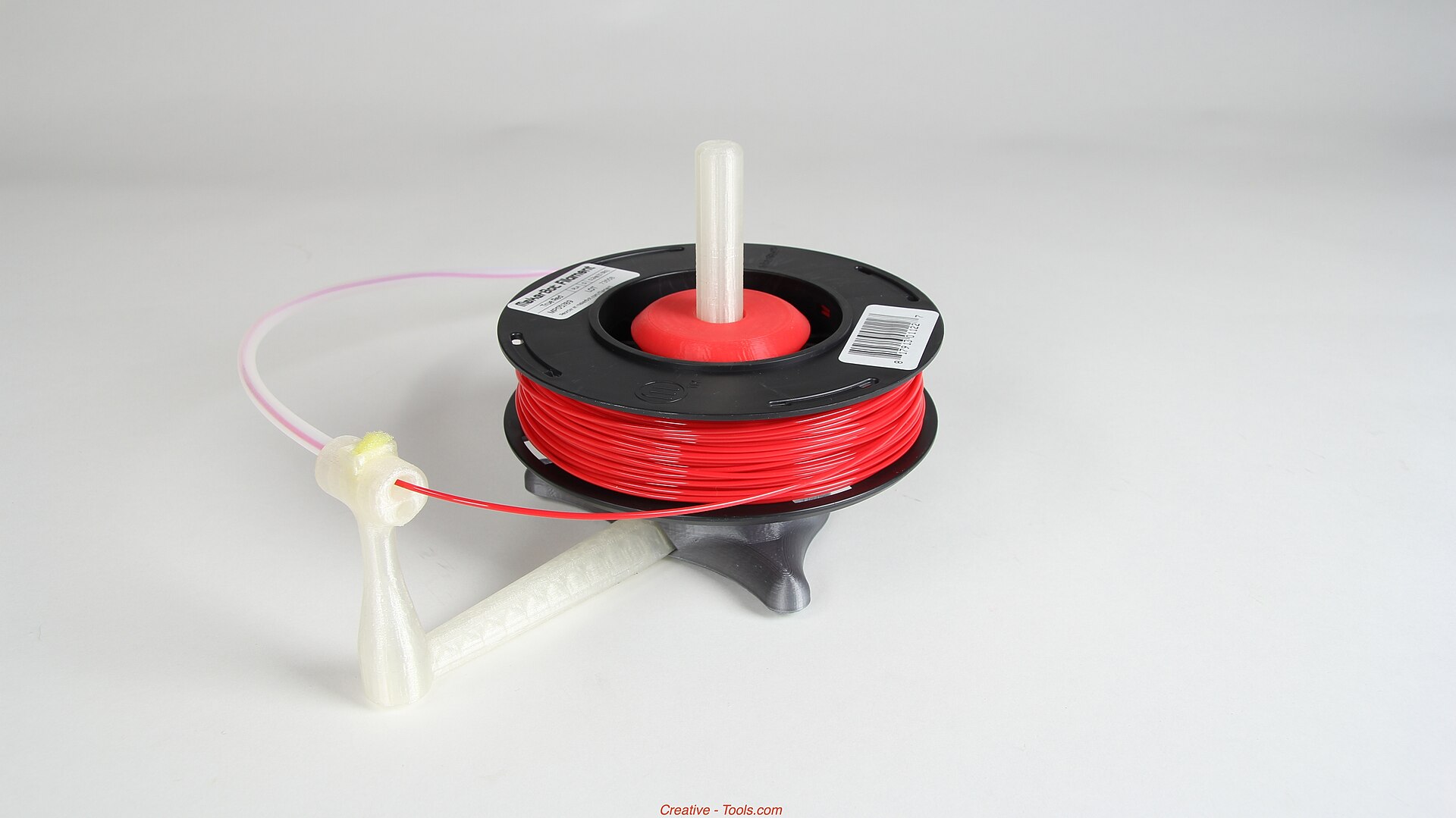 Filament wound on a spool beside a bench stand