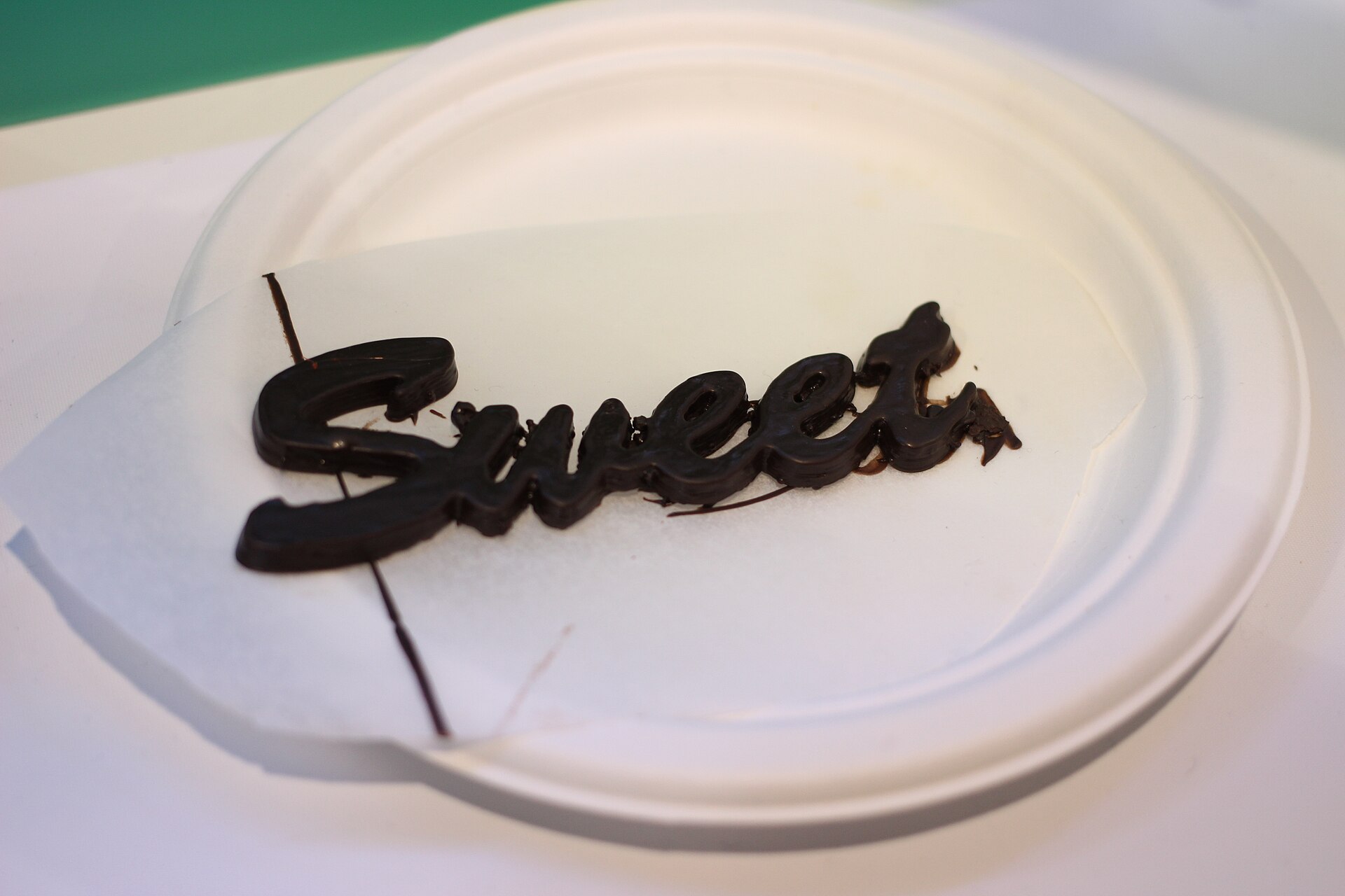 A paste printer arranged to deposit chocolate