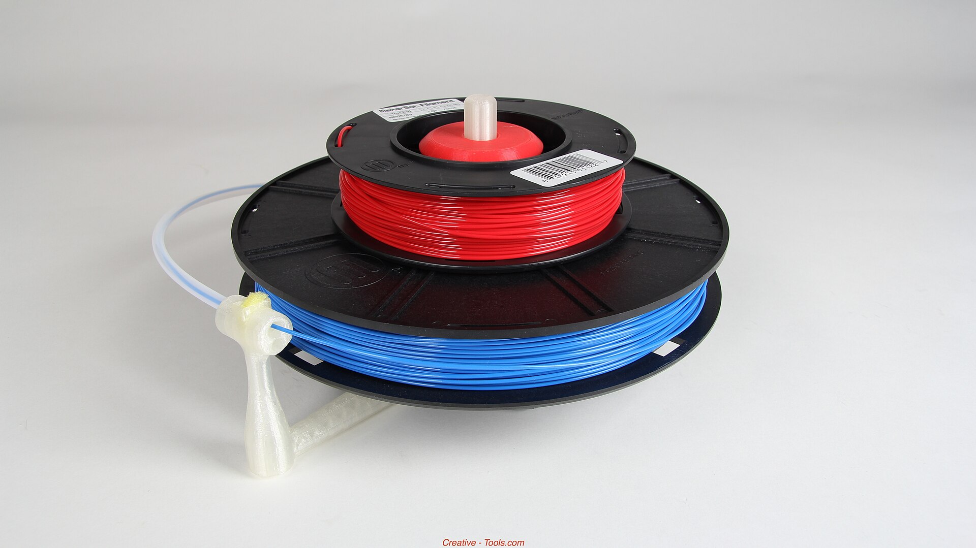 A printable stand holding a spool of filament