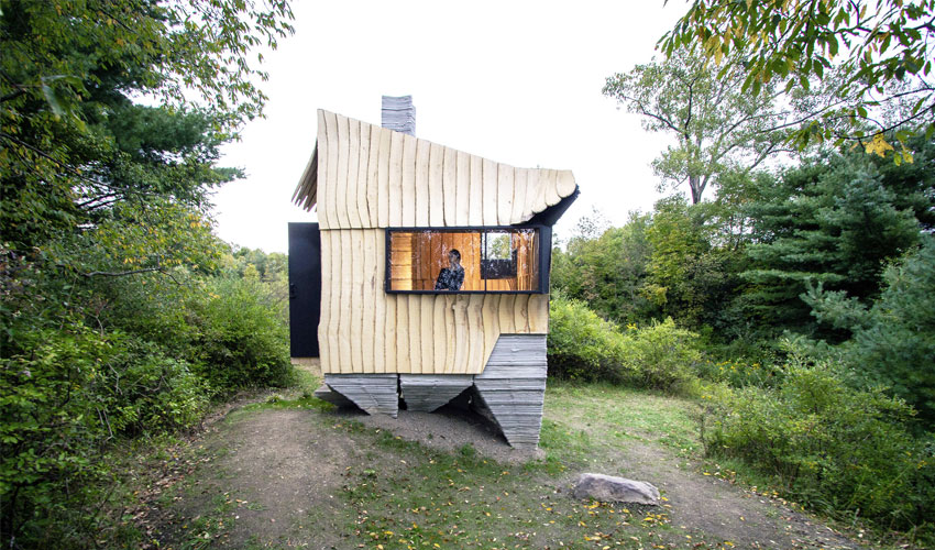 A 3D printed and recycled wood cabin