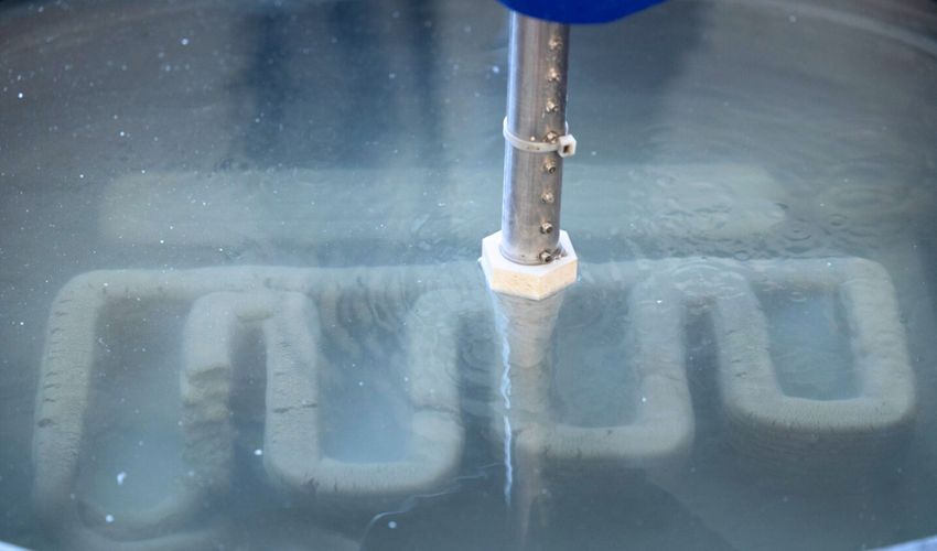 Underwater Concrete 3D Printing Using Seafloor Sediment