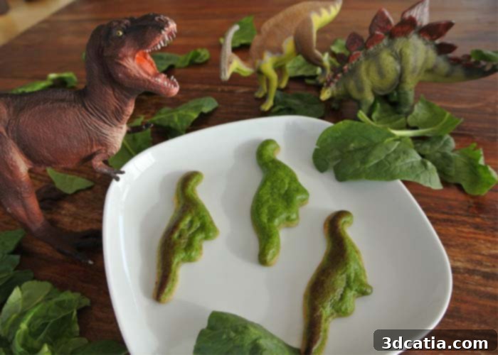 Children eating 3D printed spinach in fun shapes like dinosaurs.