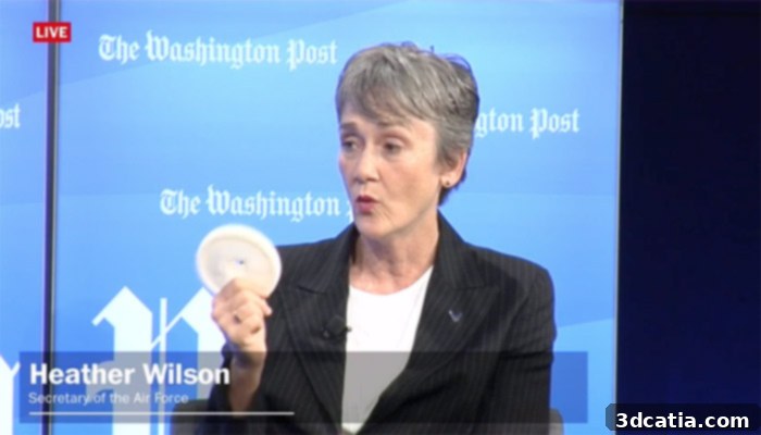 Secretary Heather Wilson demonstrating a 3D printed KC-135 part