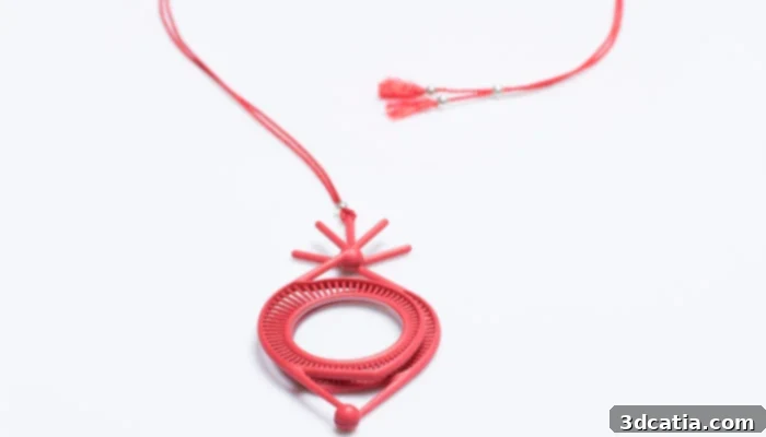 3D printed F-elia optical jewelry highlighting intricate designs and material finishes.
