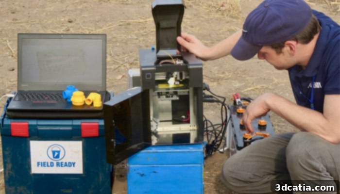 Field Ready team setting up a 3D printer on-site in a disaster area to produce essential items.
