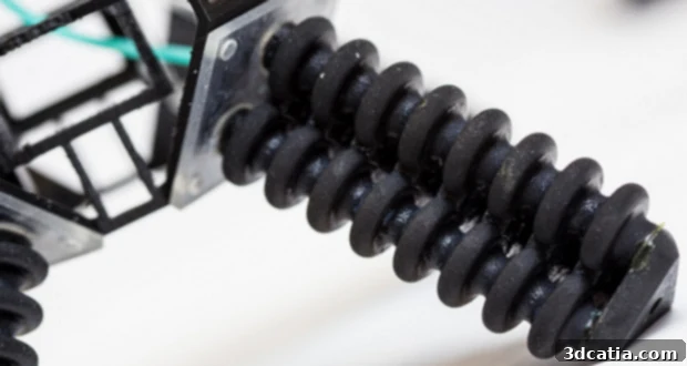 Unstoppable: The Multi-Terrain 3D Printed Robot 4 The 3D printed soft robot successfully demonstrating its ability to move on an obstacle, highlighting its adaptable nature.