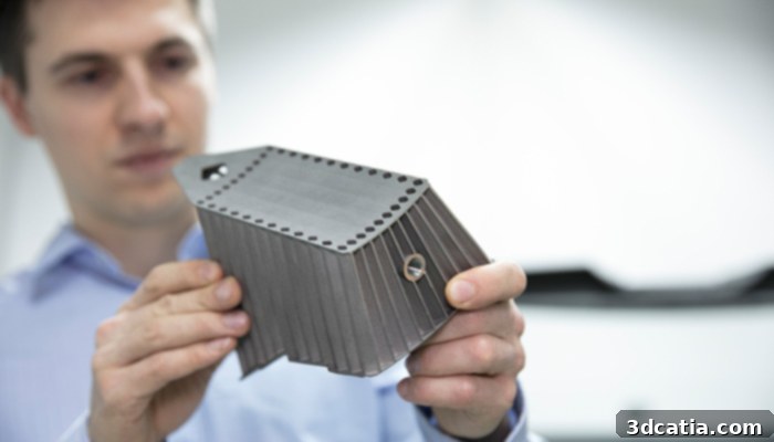 Engineer inspecting a 3D printed tool for welding repairs