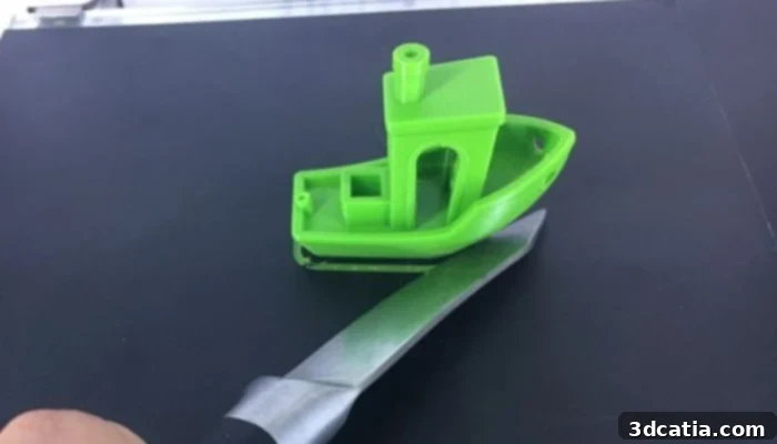 Removing a 3D printed part with a spatula