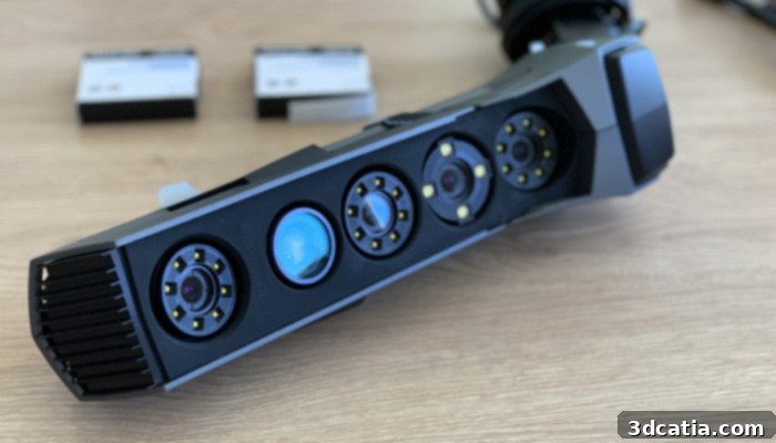 The Creaform Go!SCAN 3D, featuring a white light projector, three high-resolution tracking cameras for precise geometric data acquisition, and a dedicated color camera for capturing vibrant textures.