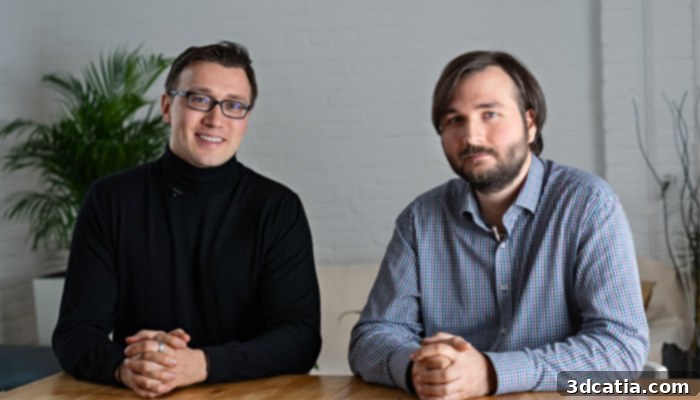 The two iFactory founders, Artur Steffen and Martin Huber, stand proudly beside their innovative iFactory One conveyor belt 3D printer, symbolizing their collaborative vision for continuous manufacturing.
