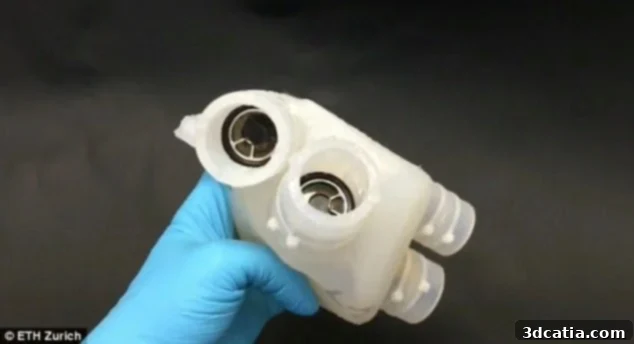 Researchers examining the 3D printed silicon heart, highlighting its realistic texture and form