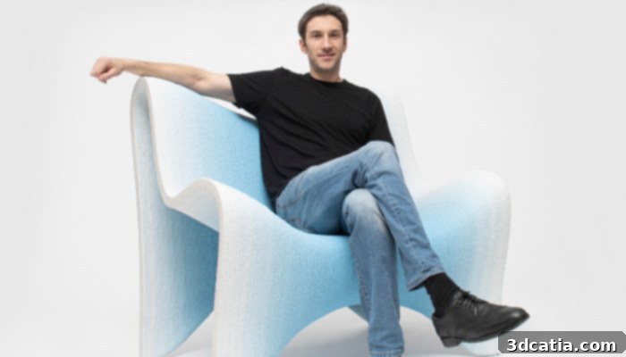 Designer Philipp Aduatz with his 'Gradient fauteuil,' showcasing innovative 3D printed furniture