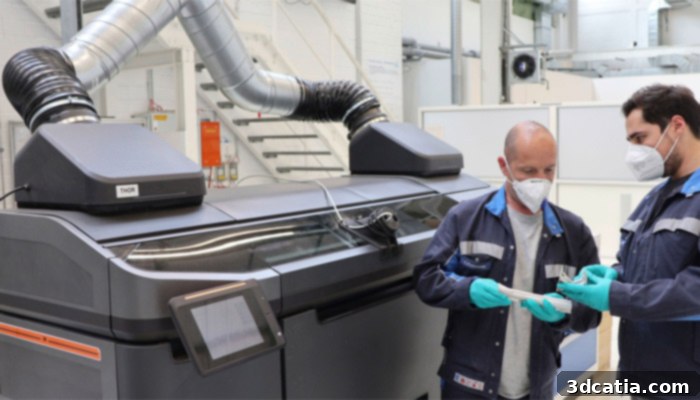 Volkswagen employees checking 3D printed parts