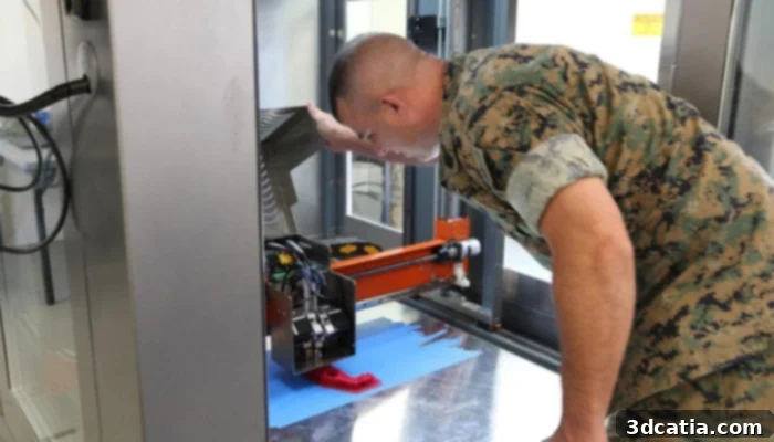 A Marine operating a 3D printer, demonstrating the integration of additive manufacturing into military operations.