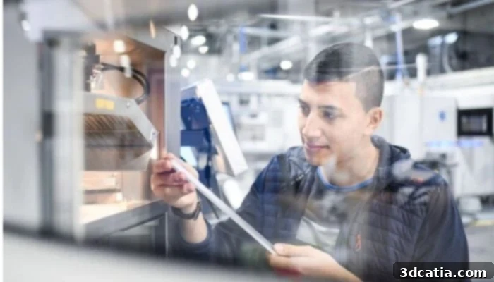 Metal 3D printer operator monitoring a Powder Bed Fusion Laser Beam machine.