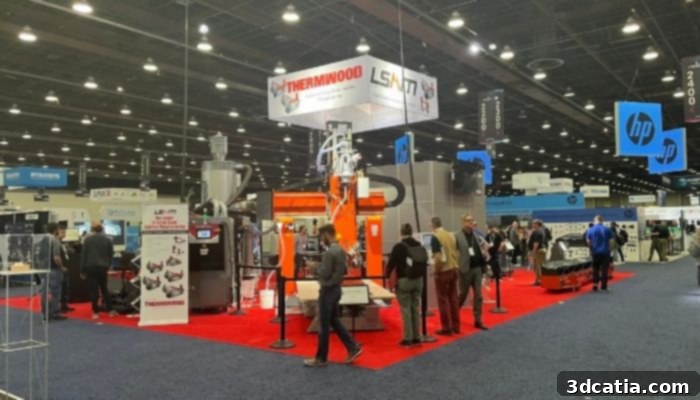 Attendees at RAPID + TCT 2022 engaging in discussions on the exhibition floor.
