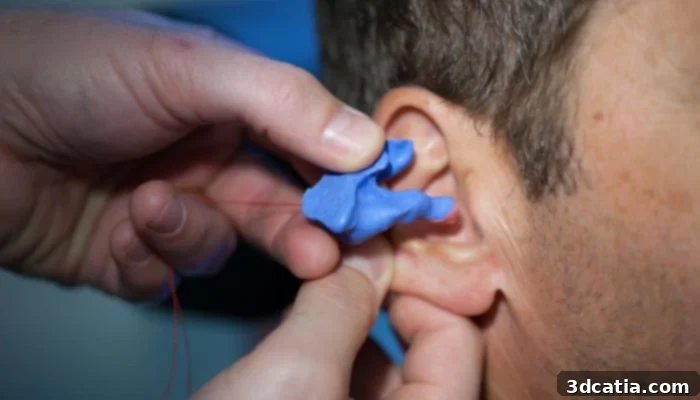 Close-up of a modern 3D printed hearing aid, symbolizing innovative manufacturing and medical technology.