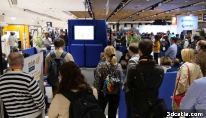 Attendees at 3D Print Paris discussing additive manufacturing solutions