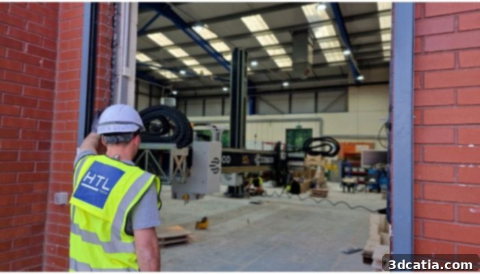 Workman overseeing the installation of a COBOD 3D Printer in Accrington and Rossendale College