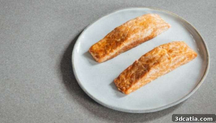 A perfectly cooked Plantish salmon fillet, showcasing its realistic texture and appearance.