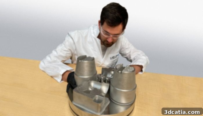 Engineer with parts made of M300 Tool Steel, Velo3D’s latest qualified material