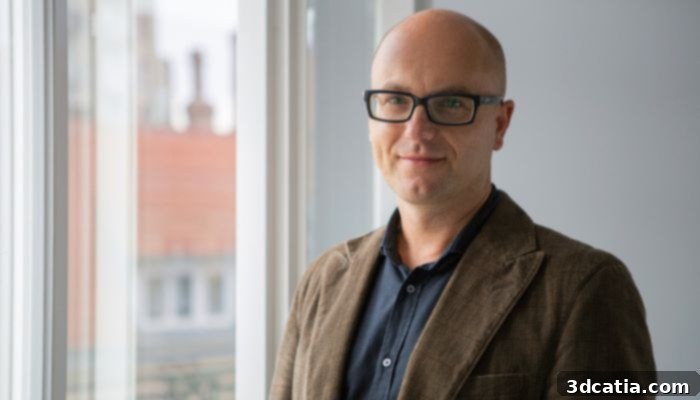 Paweł Robak, CEO of OMNI3D, discussing industrial 3D printing advancements and market strategies.