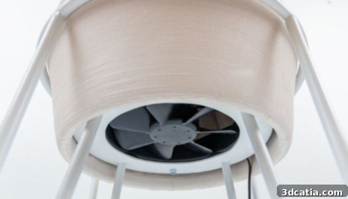 A 3D printed terracotta air cooler with an integrated fan for air distribution, showcasing the intricate, porous design.
