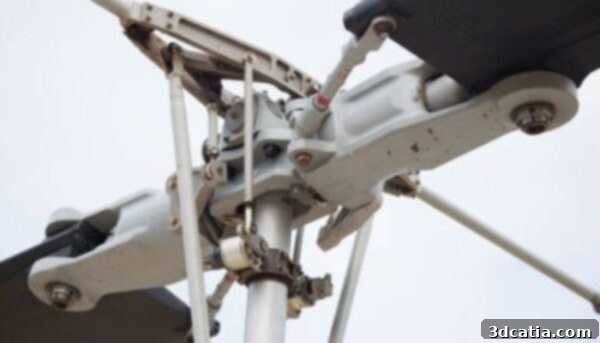 Close-up of a helicopter main rotor system, highlighting complex mechanical components.