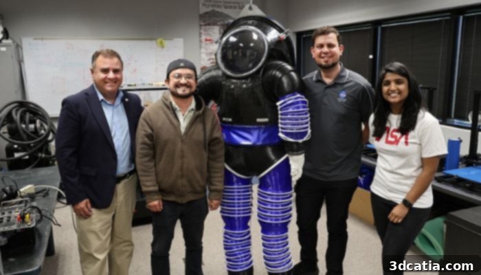 Professor Pablo de León with doctoral students and 3D printed spacesuit prototype