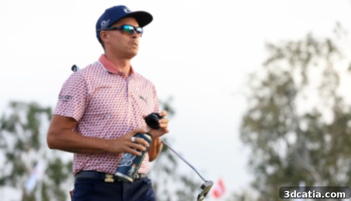 Mid-shot of Pro golfer Rickie Fowler as he assesses the golf course.