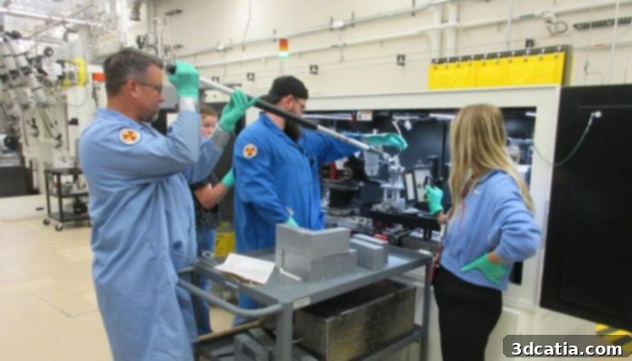 INL technicians working in a laboratory setting, conducting nuclear material research.