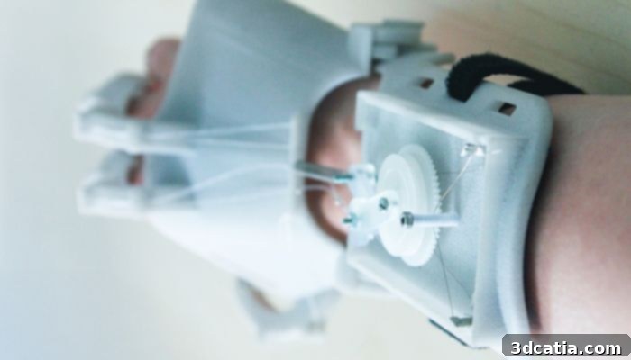 A stepper motor and wires assist the hand’s movements.