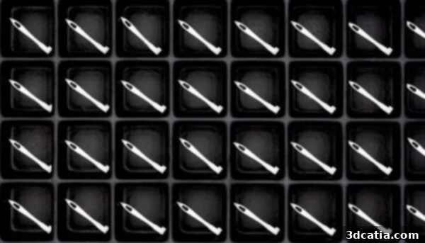 Multiple 3D printed ceramic needles on a build platform, demonstrating serial production capability.