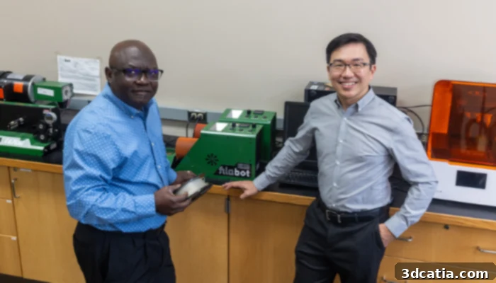 Dr. John Obielodan (left) and Dr. Joseph Wu (right) stand in their lab after announcing the new patented material. (Photo Credit: University of Wisconsin-Platteville)