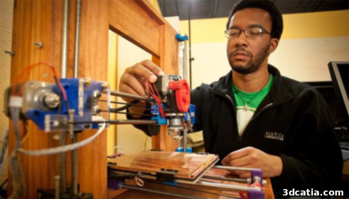 Alan Ware working on a 3D printer at Hacker Lab