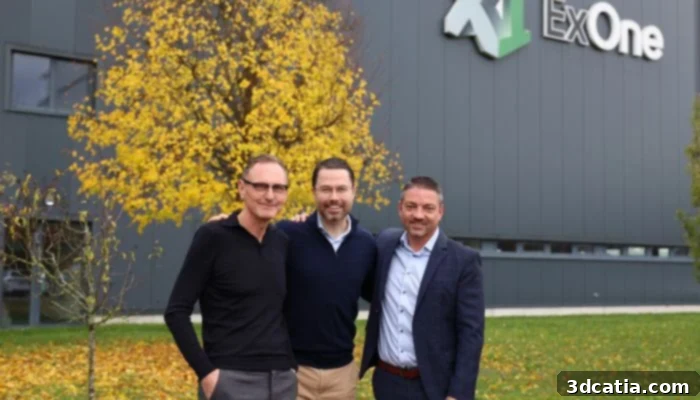 Rudolf Franz, Whitney Haring-Smith, and Eric Bader in front of Exone building