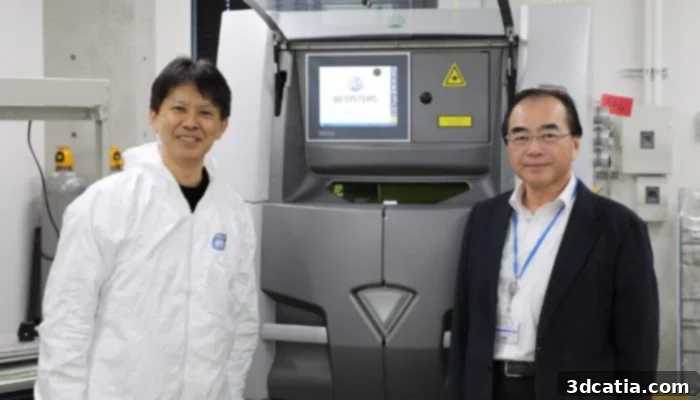Naoki Takata and Masaki Kato with laser 3D printer